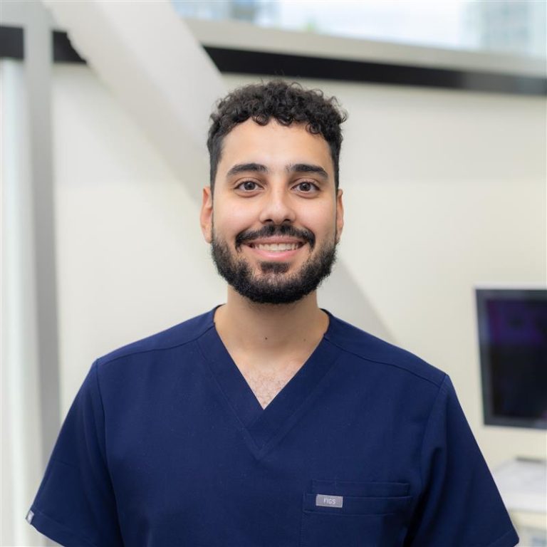 A picture of a smiling dentist.